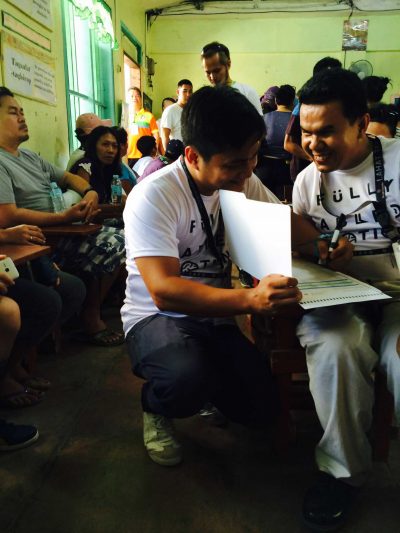 Marvelous Jorda works with an assistant from FAN to cast his vote at Gun-ob Elementary School in Lapulapu City, Cebu on May 9. 