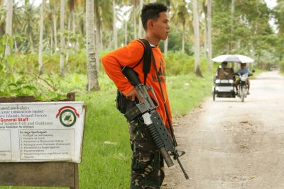 Photo from Mindanao, Philippines: soldier at a checkpoint.