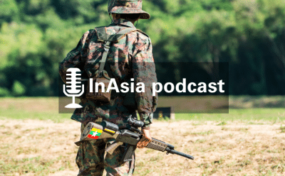InAsia podcast title card with a background photo featuring a lone soldier stands in field.