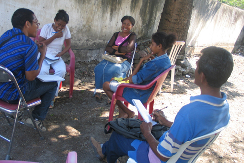 Community members consult legal aid workers in Timor-Leste