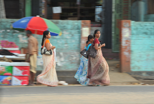 Women walk along in Sri Lanka's capital