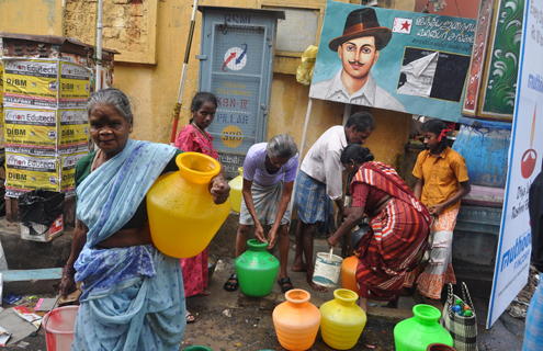 Women collect water in India. 