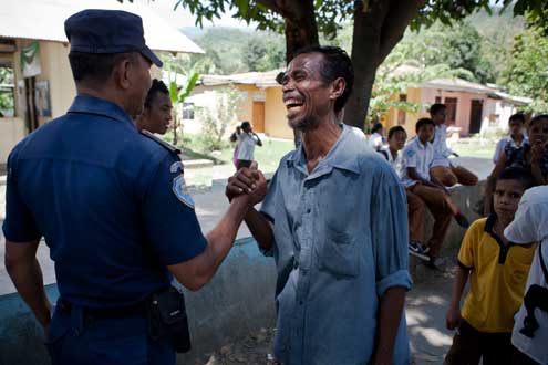 A community police officer walks through Becora talking to community members. With limited resources and training, Timor’s police service faces the challenge of moving from a crisis response and public order orientation to helping to prevent disputes from escalating. A nascent community policing program is helping to address these challenges. Photo/Conor Ashleigh 