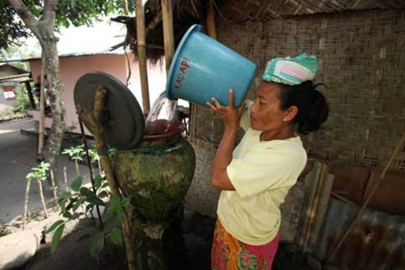 Indonesian woman collects water